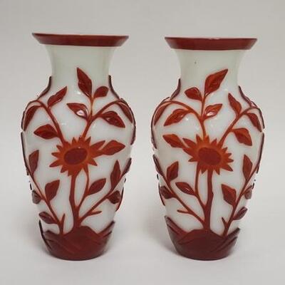 1006	PAIR OF RED OVER WHITE CHINESE CAMEO VASES HAND INSCRIBED *CHINA* ON THE BASES. ONE HAS A SMALL RIM NICK. 8 IN H 
