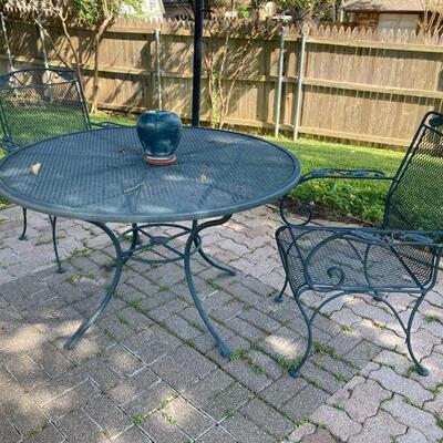 Iron patio table with two chairs