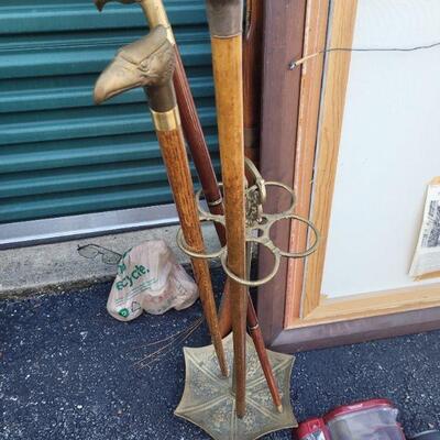 A Brass umbrella stand, excellent condition, with three walking sticks, each sold separately, see pictures for details