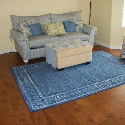 Leggett & Platt Blue Plaid Sleeper Sofa ; Tan Micro-suede Ottoman ; Floor Lamp