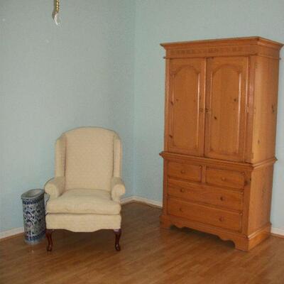 Wynwood Furniture Co. Armoire/Dresser ; Best Chair Co. Cream Colored Wing Back Chair.