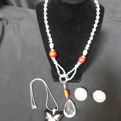 Two necklaces one by Givenchy one by Debaux when pair white clip-on earrings by Joanne