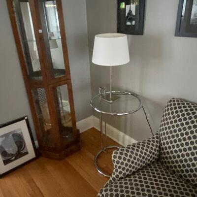 Upholstered chair/ottoman with adjustable chrome/glass side table -- display cabinet on the side
