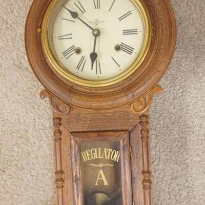 1342	REGULATOR WALL CLOCK IN CARVED CASE, AS FOUND, CREST REPAIRED, 29 3/4 IN HIGH X 10 1/2 IN WIDE
