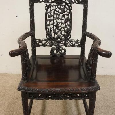 1082	HEAVILY CARVED ASIAN HARDWOOD ARM CHAIR, 21 1/2 IN WIDE X 41 IN HIGH
