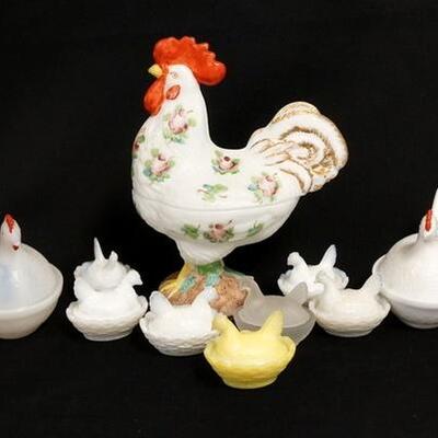 1302	10 GLASS HENS ON A NEST, INCUDES A LARGE HAND PAINTED ROOSTER, 8 3/4 IN HIGH, A SMALL & A MEDIUM ONE HAS A CHIP ON THE BEAK
