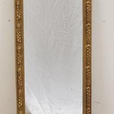 1299	TALL OVAL MIRROR, FRAME HAS RELIEF FLORAL DECORATION, 55 IN HIGH X 15 3/4 IN WIDE
