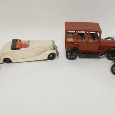 1347	4 TOY TIN CARS, ONE IS FRICTION, JAPAN, LONGEST IS 7 1/2 IN
