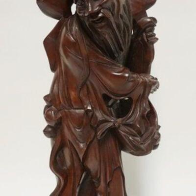 1022	LARGE ASIAN WOOD CARVING OF MAN CLINGING TO TREE, MISSING TOP FINIAL, 24 IN HIGH
