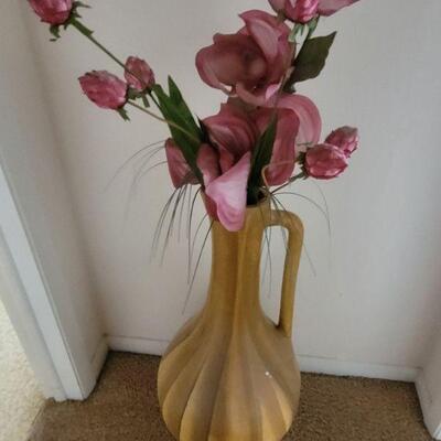 large vase with artificial flower arrangement