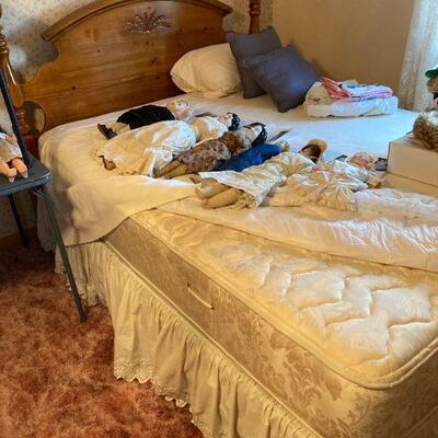 Double bed and antique dolls