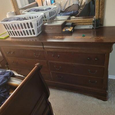 bedroom dresser, in good condition, needs to be refinished, there is a sleigh bed and two nightstands that go also