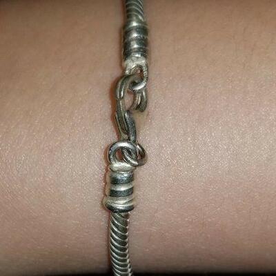 https://www.ebay.com/itm/124977506946	A0016. Sterling Silver Charm Bracelet 	 BIN 	 $19.99 

