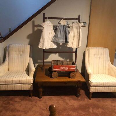 Two Upholstered Chairs, Square Coffee Table, Coca-Cola Crate Cart, Blanket Rack, Vintage Newborn Clothes.