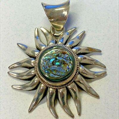 https://www.ebay.com/itm/125060430076	NC588 LARGE ABOLONE SUN CHARM BY LETY G IN STERLING SILVER		 BIN 	 $49.99 
