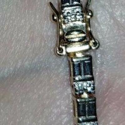 https://www.ebay.com/itm/115063680078	C7674 Gold on Sterling Silver Tennis Bracelet with Double Safety Clip .		 BIN 	 $29.99 
