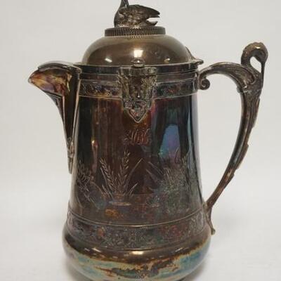 1003	REED & BARTON SILVER PLATED ICE WATER PITCHER, HAS A SWAN FINIAL, STORK HANDLE & FACES, PORCELAIN LINER, MONOGRAMMED, LAST PATENT...