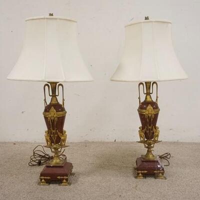 1002	PAIR OF BRONZE MOUNTED RED MARBLE LAMPS, DECORATED W/WINGED GRIFFENS & LADIES FACES, ONE FOOT ON ONE LAMP IS LOOSE
