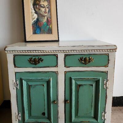Cute "chippy" distressed cabinet