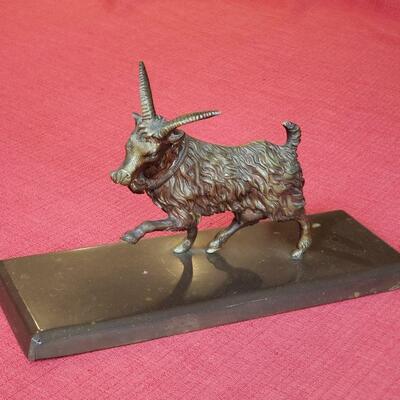Bronze goat on marble 