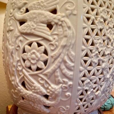 Reticulated Porcelain Blanc de Chine Ginger Jar Lamp (there are two of them, one on either end of the cabinet) The interior light comes...