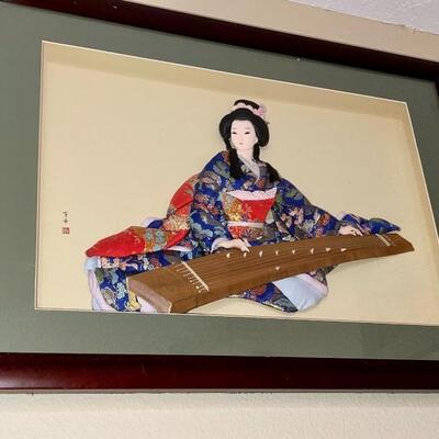 Japanese woman in Kimono playing the Koto.