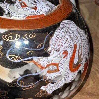Japanese Dragonware Teapot with matching cream and sugar bowls with lids. Signed on bottom.