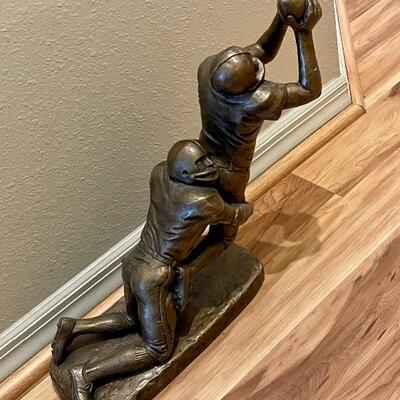 Large sculpture of football players