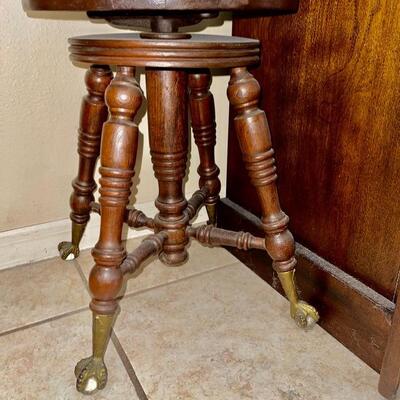 Antique adjustable piano stool with claw and ball feet