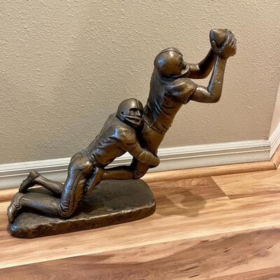 Large sculpture of football players