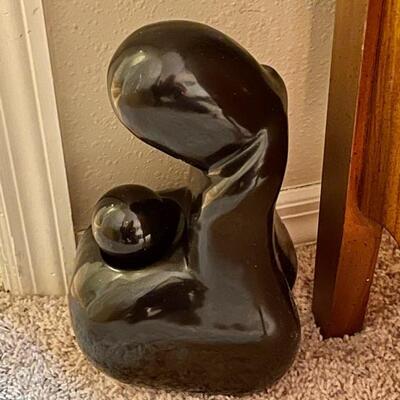 Polished stone sculpture of mother and child