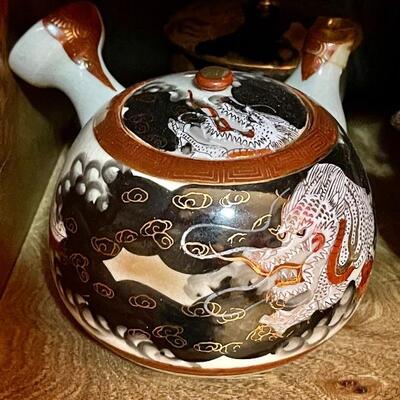 Japanese Dragonware Teapot with matching cream and sugar bowls with lids. Signed on bottom.