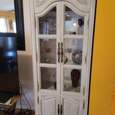 This is a very nice curio cabinet and there is another one just like it. Very high end piece of furniture in very good condition