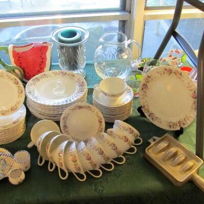 45pc. Fine porcelain china by Creative, "Regency Rose"  The metal item is actually a fishing lure mold.