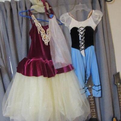 Several quality girls dress up, dance, play, or costume dresses.