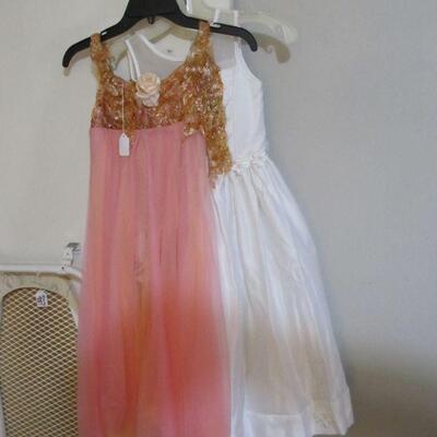 Several quality girls dress up, dance, play, or costume dresses.