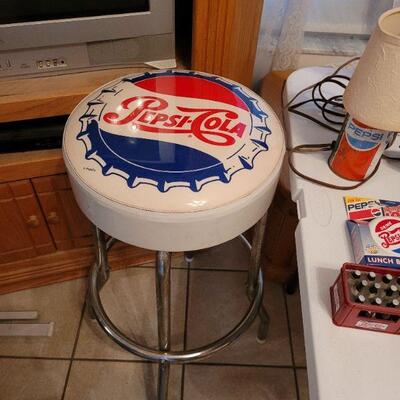 there are four Pepsi bar stools