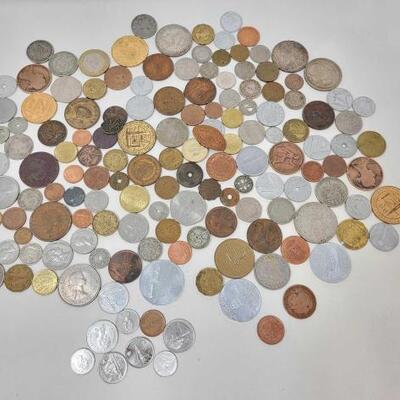 #1574 â€¢ Assortment of Foreign Currency and Commemorative Plastic Tokens