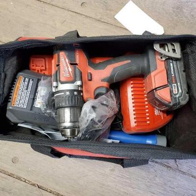 #7030 â€¢ Milwaukee Tool Bag With Milwaukee Drill, Batteries, Amd More