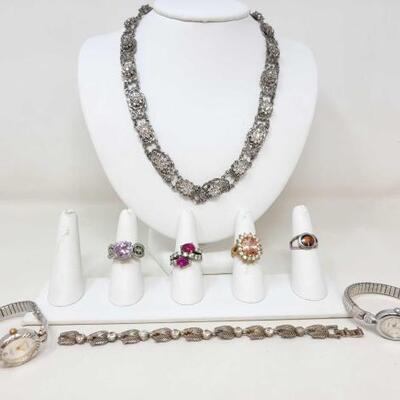 #1252 â€¢ Costume Jewelry:m Includes Necklace, Bracelet, (2) Wrist Watches, (4) Rings. 