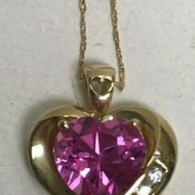 https://www.ebay.com/itm/124977506891	NCJ07 PINK HEART GEM IN 10K GOLD SETTING AND 18 IN CHAIN		 BIN 	 $149.99 
