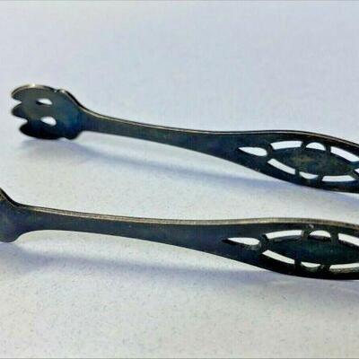 https://www.ebay.com/itm/115120675289	NC572 ANTIQUE TONGS SMALL STERLING SILVER		 Offer 	 $49.99 
