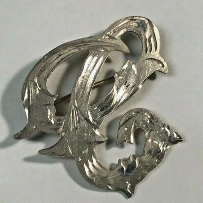 https://www.ebay.com/itm/124977512776	NC442 Cursive Filigree Letter C or E Pin Mexican Sterling Silver 		 BIN 	 $19.99 
