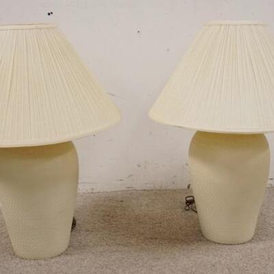 1247	PAIR OF POTTERY LAMPS W/ IMPRESSED DECORATION, 26 IN H. HAS SOME SURFACE WEAR 
