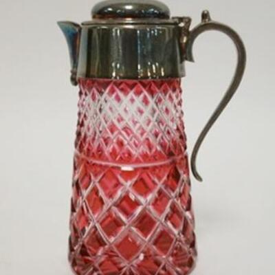 1055	CRANBERRY CUT TO CLEAR SYRUP JUG, SILVERPLATED TOP & HANDLE, 5 5/8 IN HIGH
