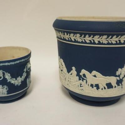1124	2 WEDGWOOD JASPERWARE JARDENIERES, MADE IN ENGLAND, LARGEST HAS A RIM REPAIR & SPIDER IN THE BASE, 8 IN HIGH
