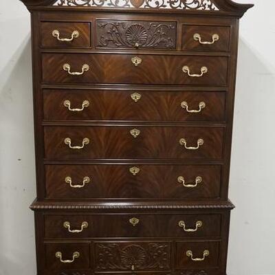 1161	HERITAGE HEIRLOOM HIGHBOY, HAS A FRETWORK ARCH, BALL & CLAW FEET & CARVED SKIRT, TOP & BOTTOM CENTER DOORS SHELL CARVED,...