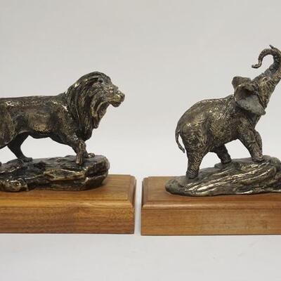 1044	PAIR OF BOOKENDS, LION & ELEPHANT, METAL ON WOODEN BASES, TALLEST IS 8 1/4 IN
