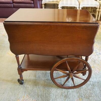 1227	IMPERIAL MAHOGANY TEA CART HAS A PULL OUT GLASS TRAY & ONE DRAWER, 28 1/2 IN X 18 1/2 IN CLOSED, DROPS ARE 11 1/2 IN, 20 IN H
