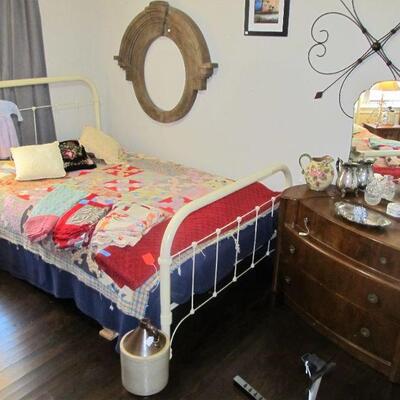 Antique Victorian cast-iron metal full-size bed w/ antique quilt & quilt tops. 2 antique Art deco dressers.